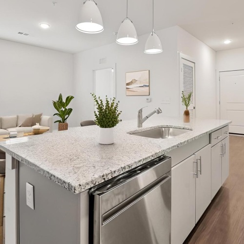 a kitchen with a bar and a sink