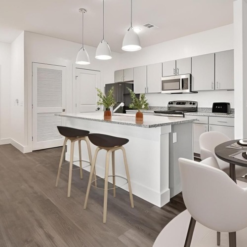 a kitchen with white cabinets