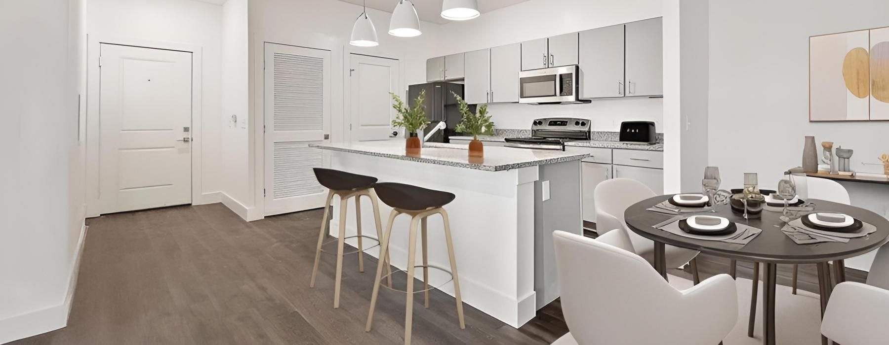 a kitchen with white cabinets